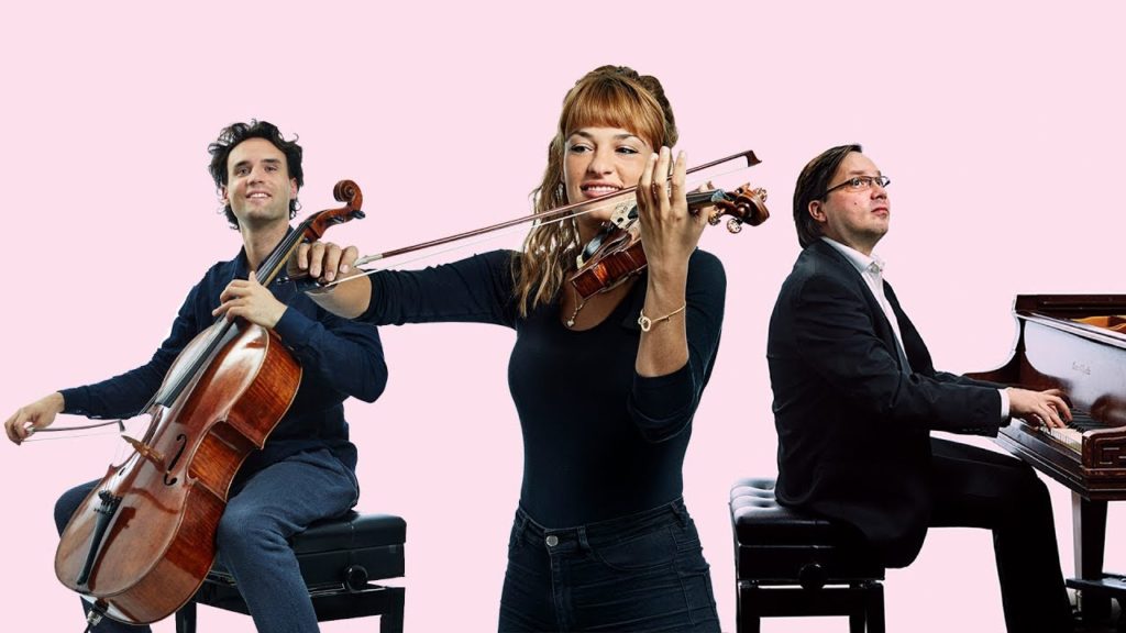 Three musicians, cello, violin and piano