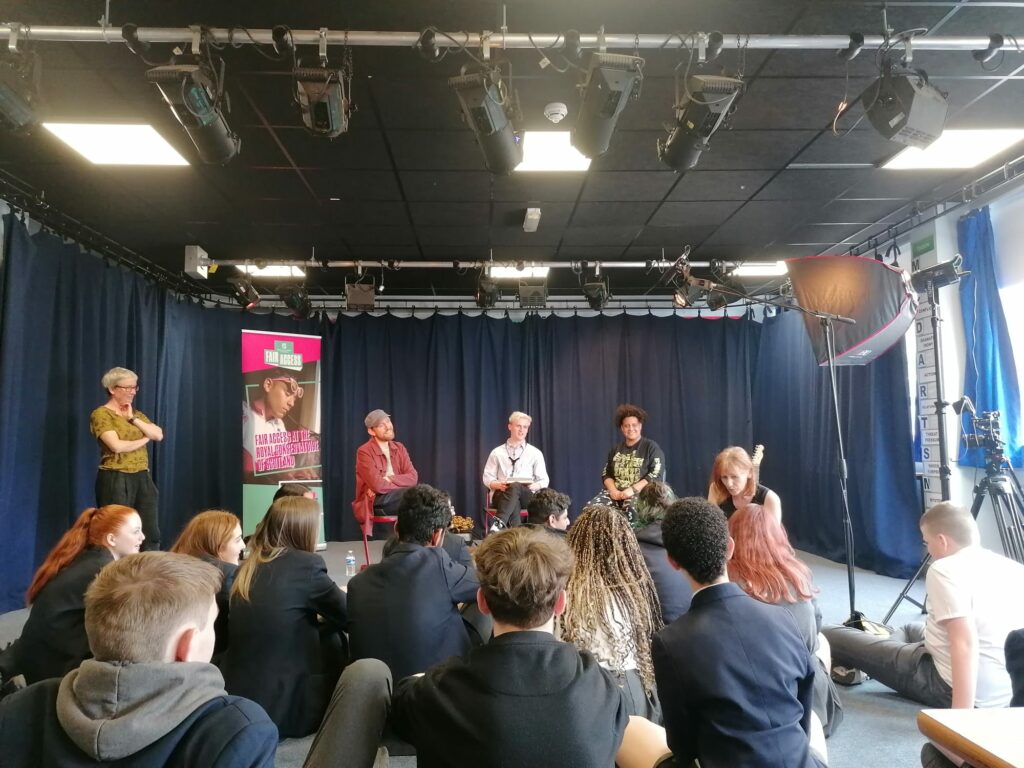 Panel of people talking to students