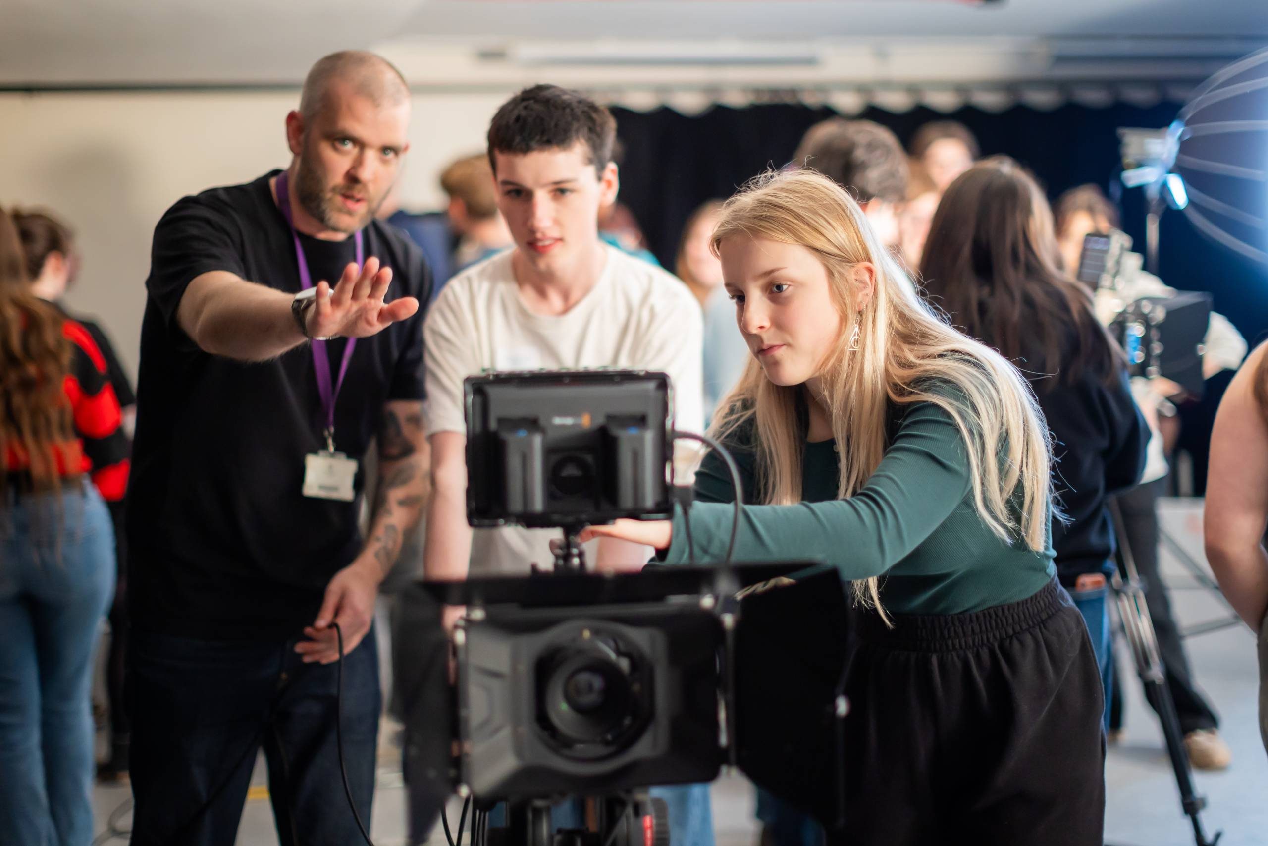 A group of filming students with a film tutor