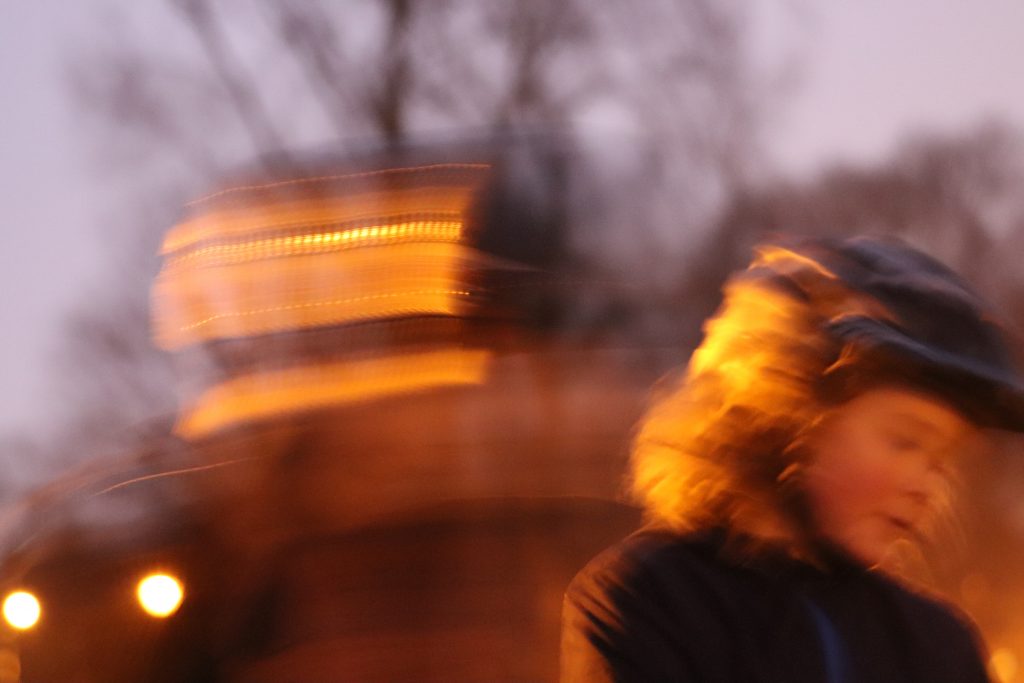Blurry image of person running in sunset lighting